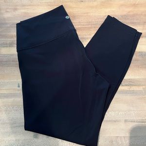 Black lululemon leggings. Size 12. 7/8 length. Only worn once!